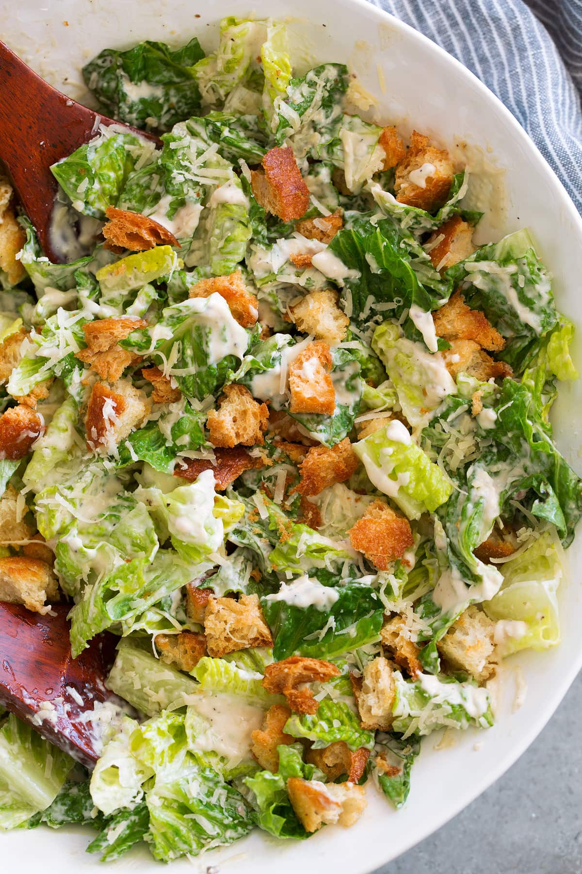Caesar Salad in a large bowl with homemade caesar salad dressing