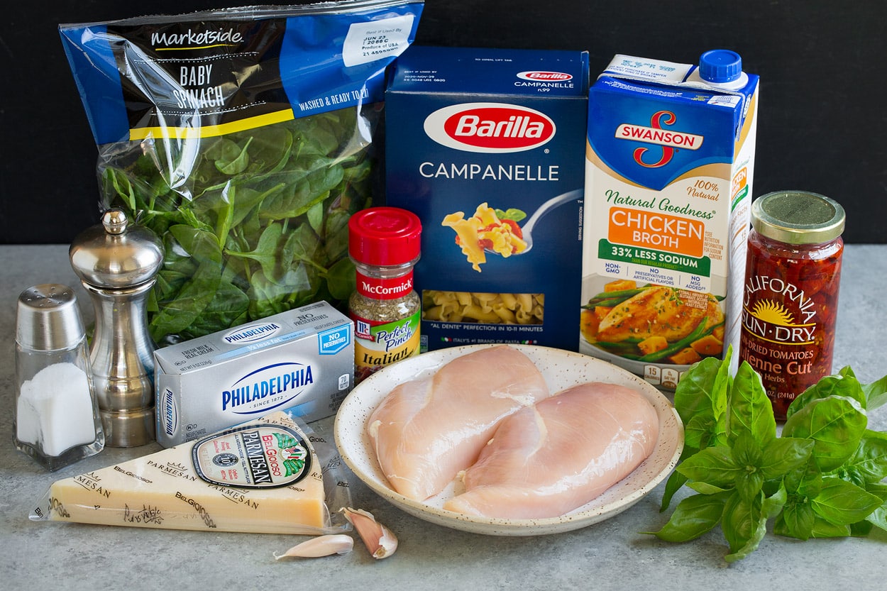 Instant Pot Tuscan Chicken Pasta ingredients parmesan cream cheese spinach italian seasoning pasta chicken chicken broth basil garlic sun dried tomatoes
