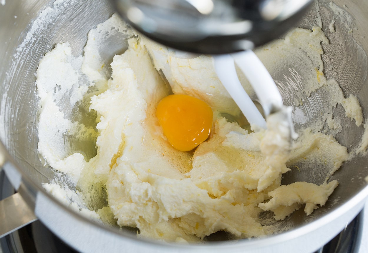 mixing in eggs to lemon blueberry bread mixture
