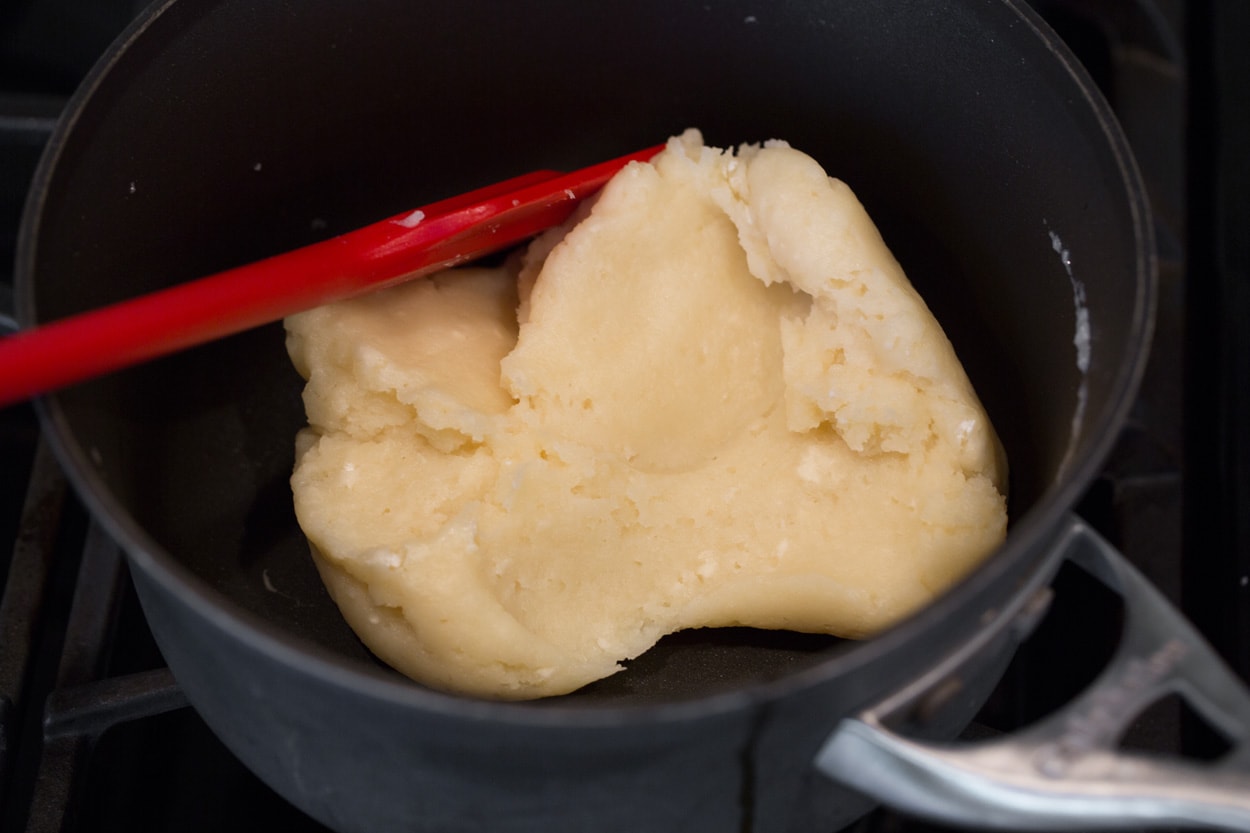churros making batter in saucepan