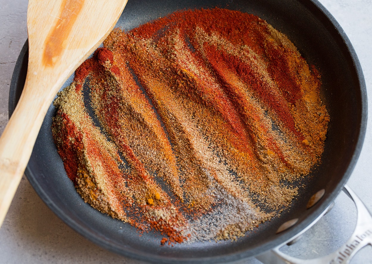 Tandoori Chicken Sautéing spices in a non-stick skillet for Tandoori Chicken.