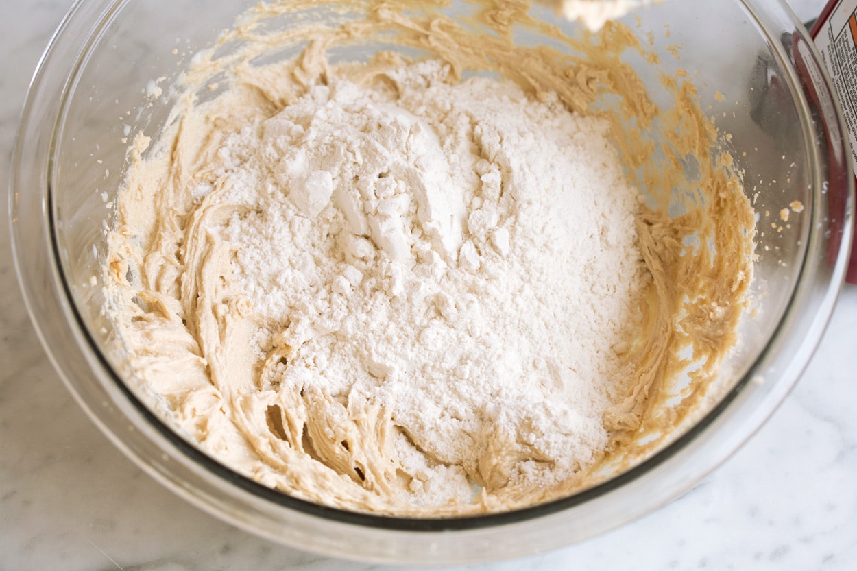 https://weightloss-reveal.com/edible-cookie-dough/ Adding flour to mixing bowl for edible cookie dough