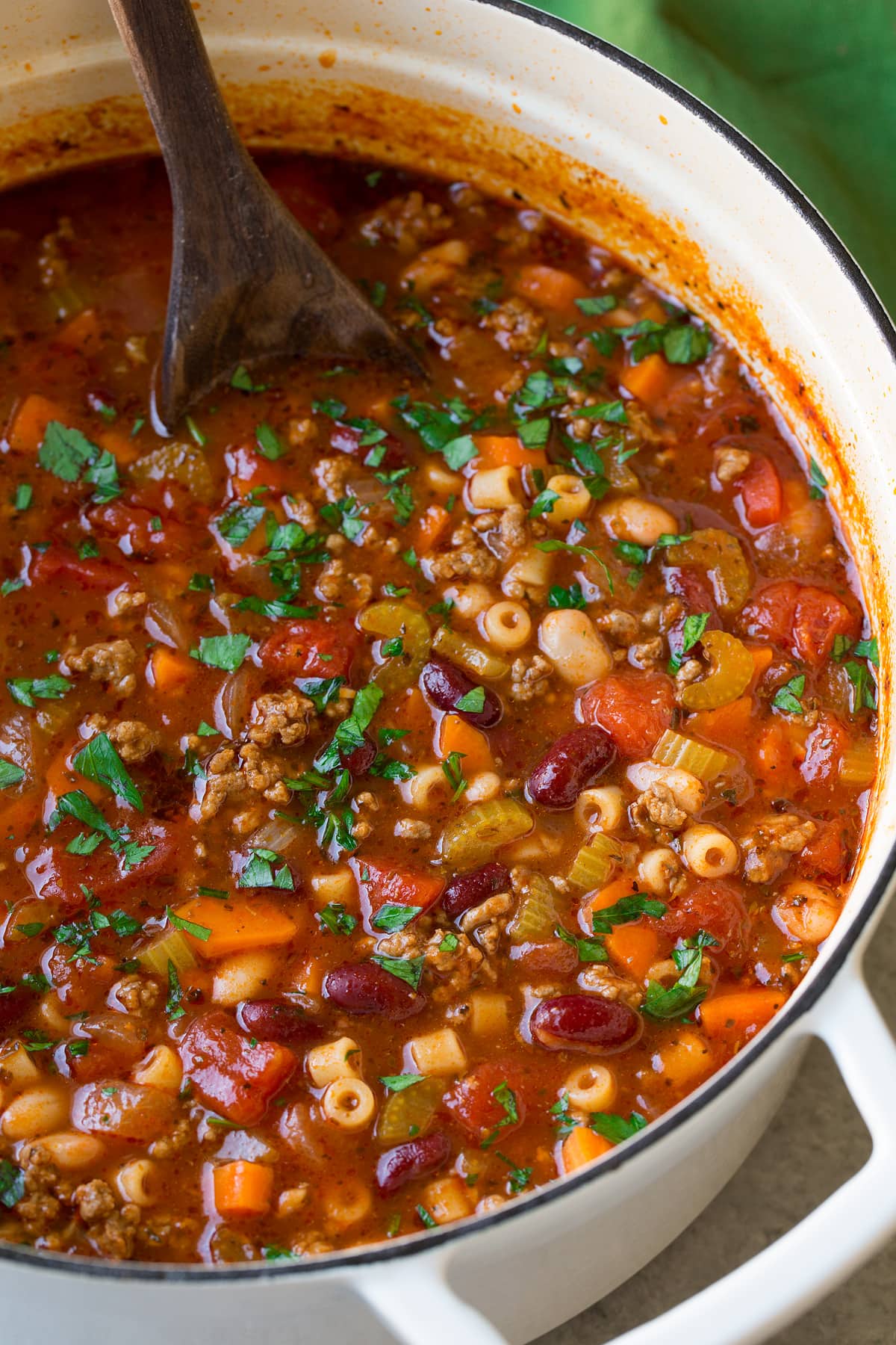 The BEST Pasta e Fagioli Soup Recipe! Pasta e Fagioli Soup in a large white pot.