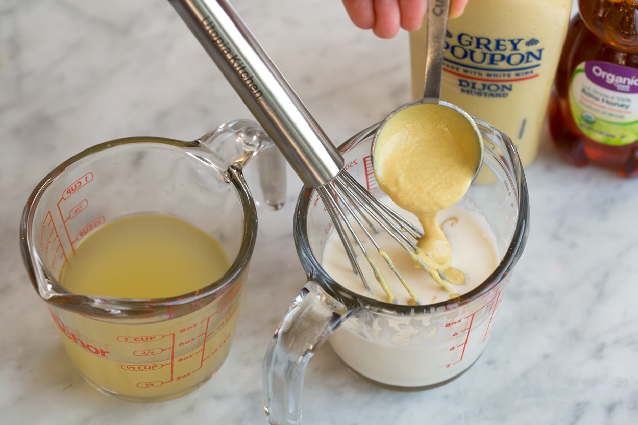 Salmon with Creamy Dijon Sauce Mixing dijon into cream in measuring cup to make sauce for Salmon.