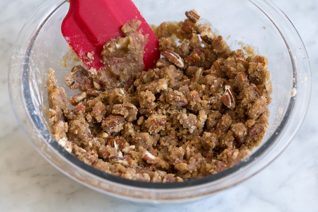 Sweet Potato Casserole Sweet potato casserole pecan topping in mixing bowl.