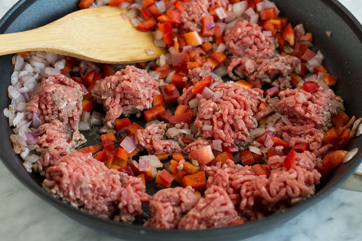 Ingredients Browning ground beef and onions in skillet to make Chimichurri Beef and Rice