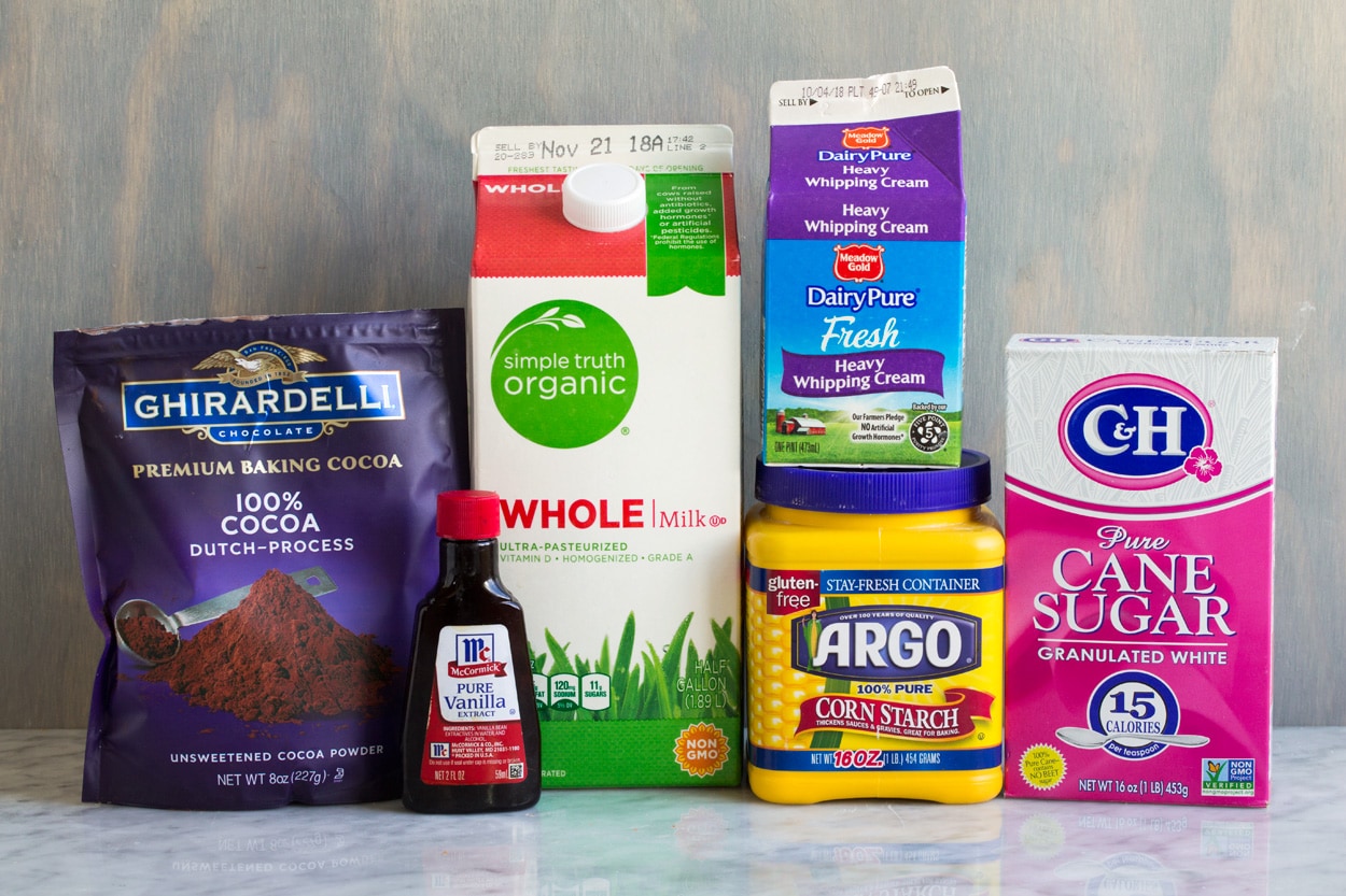 Hot Chocolate ingredients shown here cocoa power granulated sugar cornstarch whole milk vanilla extract heavy cream