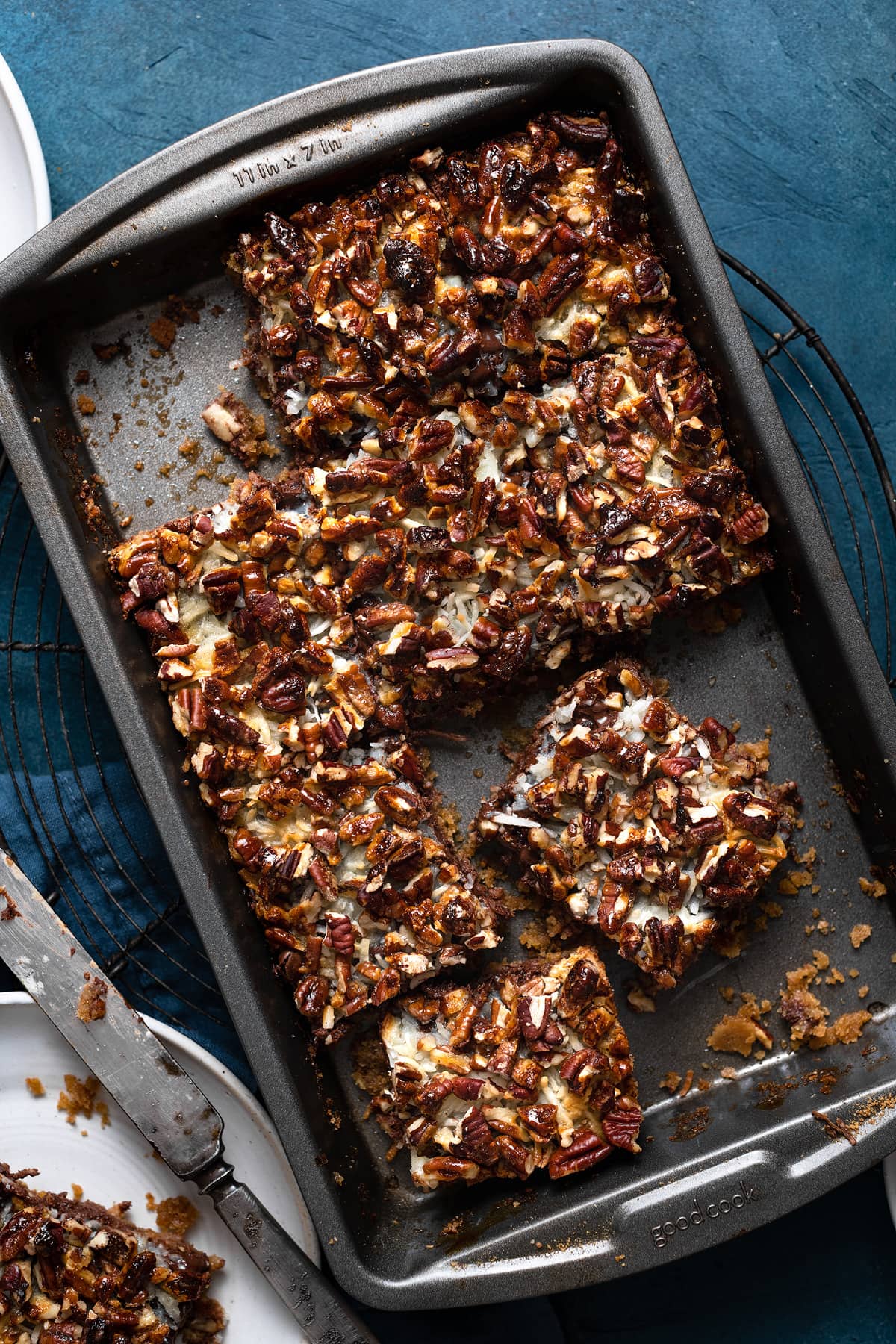 Magic Bars Finished seven layer magic cookie bars after baking cut into squares in baking dish.