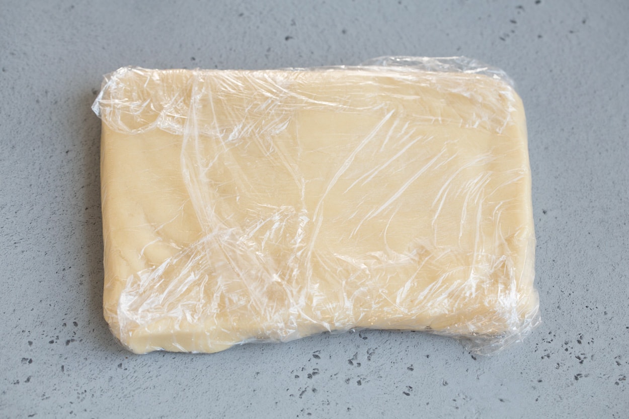 Stained Glass Cookies Stained glass cookie dough in rectangle shape in plastic wrap.