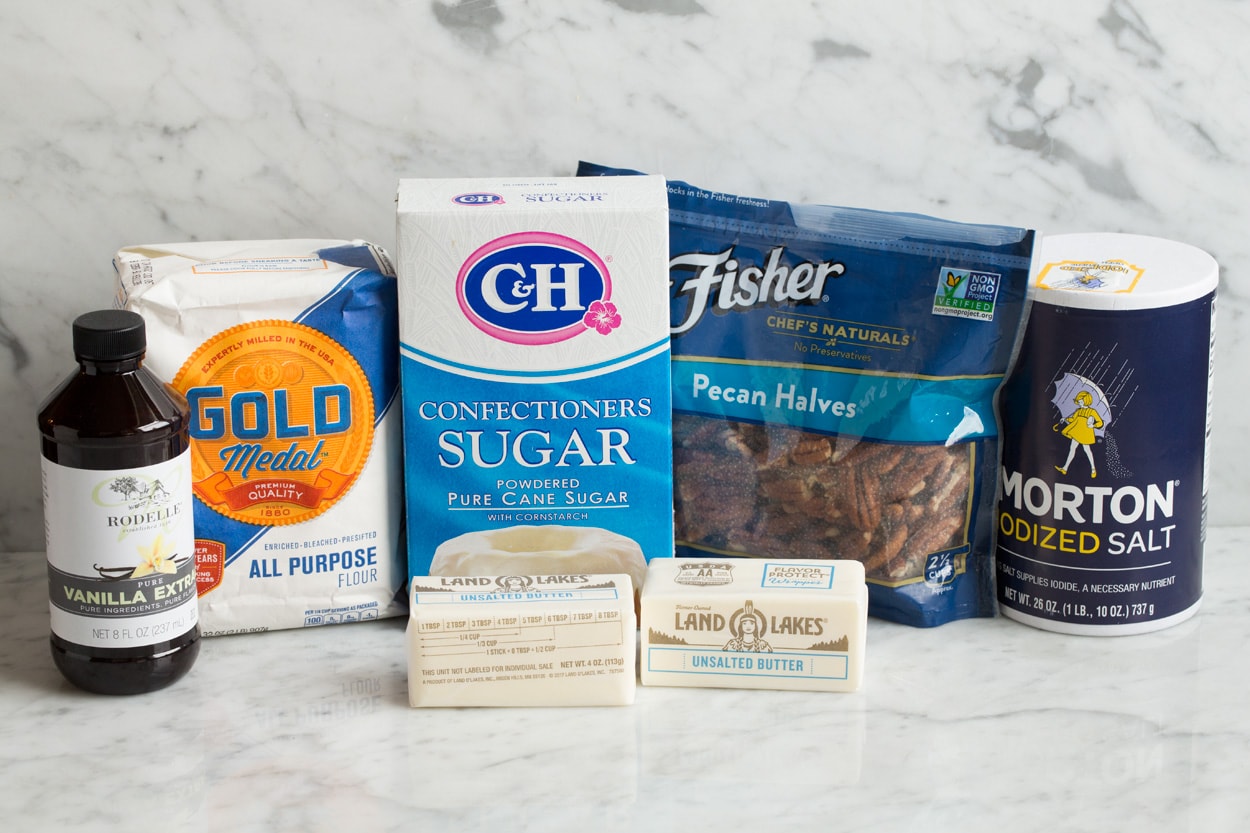Mexican Wedding Cookies Mexican Wedding Cookies ingredients shown. Flour, butter, sugar, salt, vanilla, pecans, powdered sugar