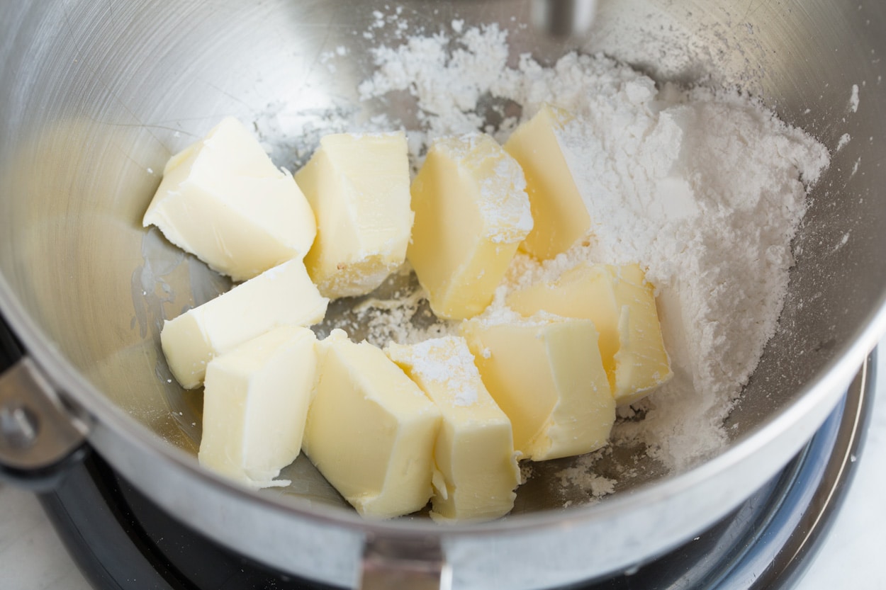 Mexican Wedding Cookies Mixing butter and powdered sugar in stand mixer bowl for Mexican Wedding Cookies