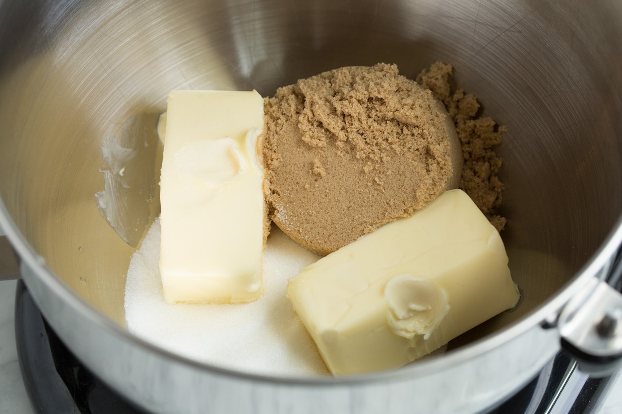 BEST Oatmeal Cookies! Mixing butter and sugars in a stand mixer to make oatmeal cookies.