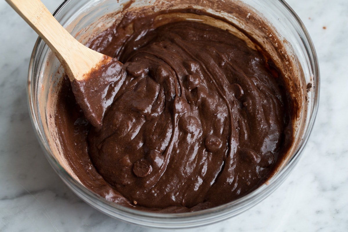 Best Cocoa Brownies Finished brownie batter in glass mixing bowl.