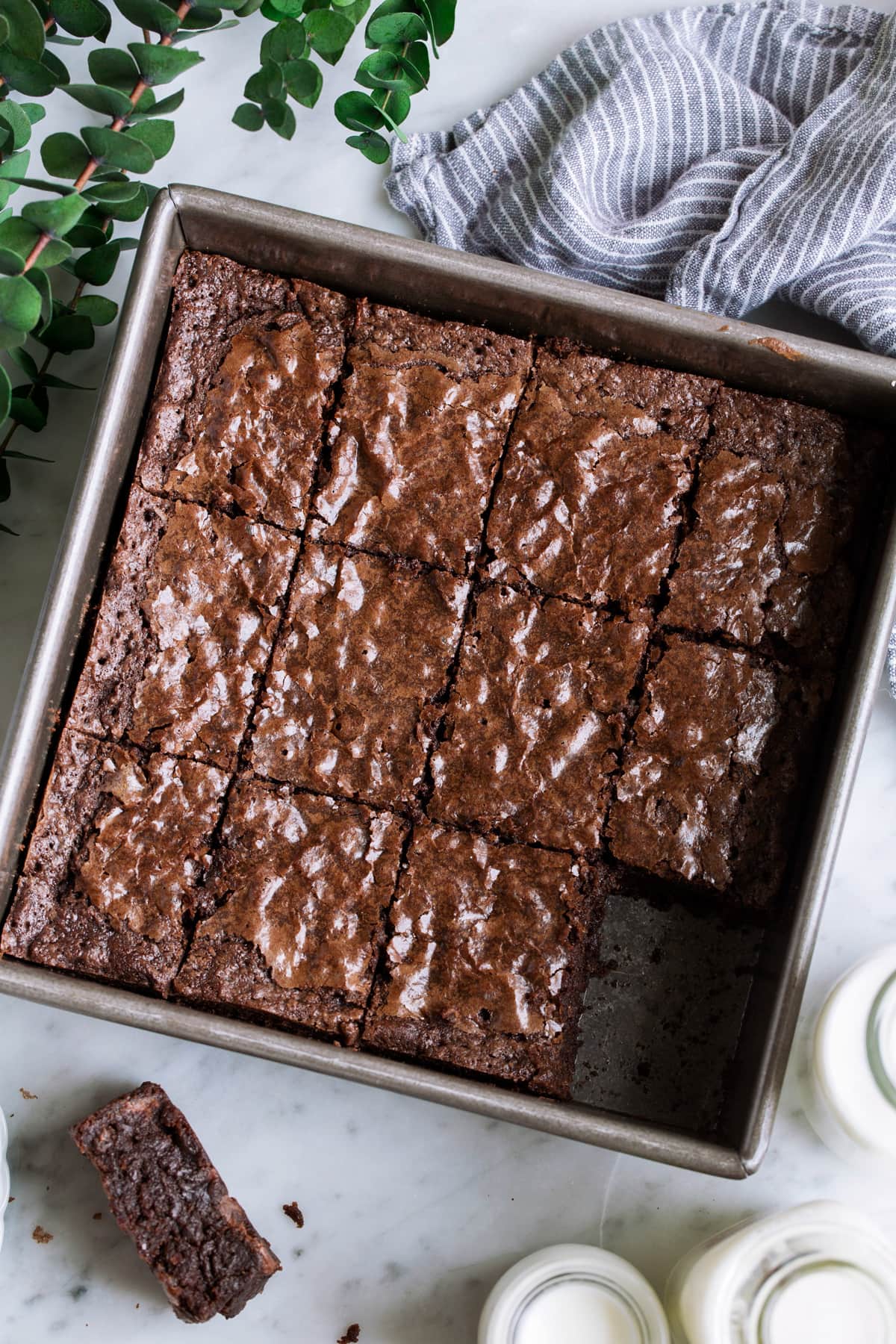 Brownies Recipe - cocoa powder based, easy to make! Overhead image of cut brownie squares in a square baking dish.