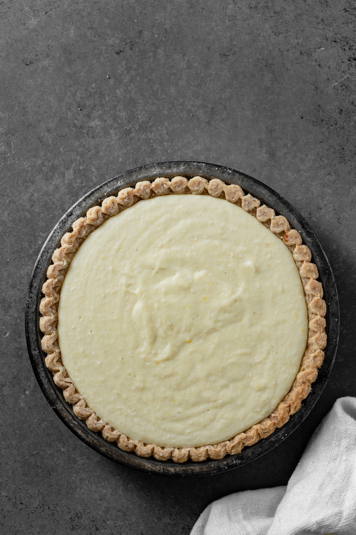 Coconut Cream Pie Showing coconut cream pie filling in a baked pie crust.