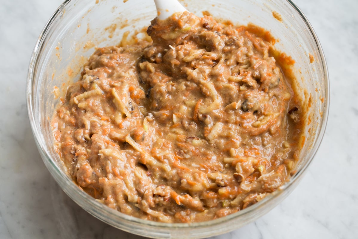 Morning Glory Muffins Finished morning glory muffin batter in a glass mixing bowl.