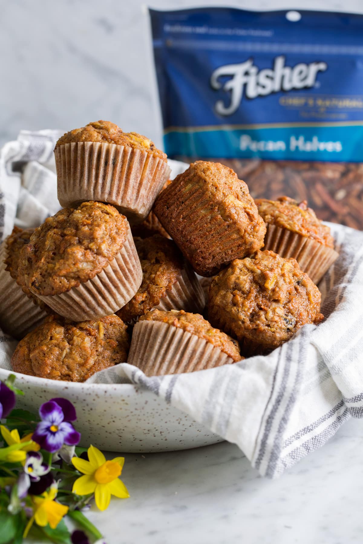 Morning Glory Muffins Morning glory muffins stacked in a speckled ceramic serving bowl