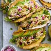 Row of salsa verde chicken tacos.