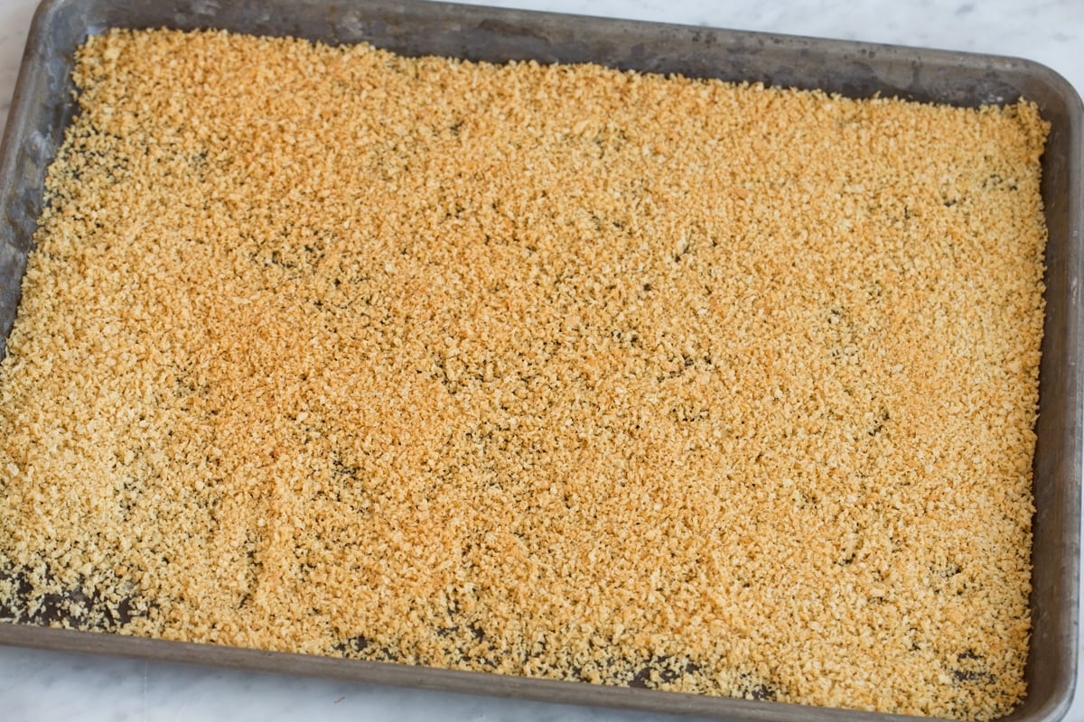Baked Chicken Nuggets Showing how to toast panko on a baking sheet.