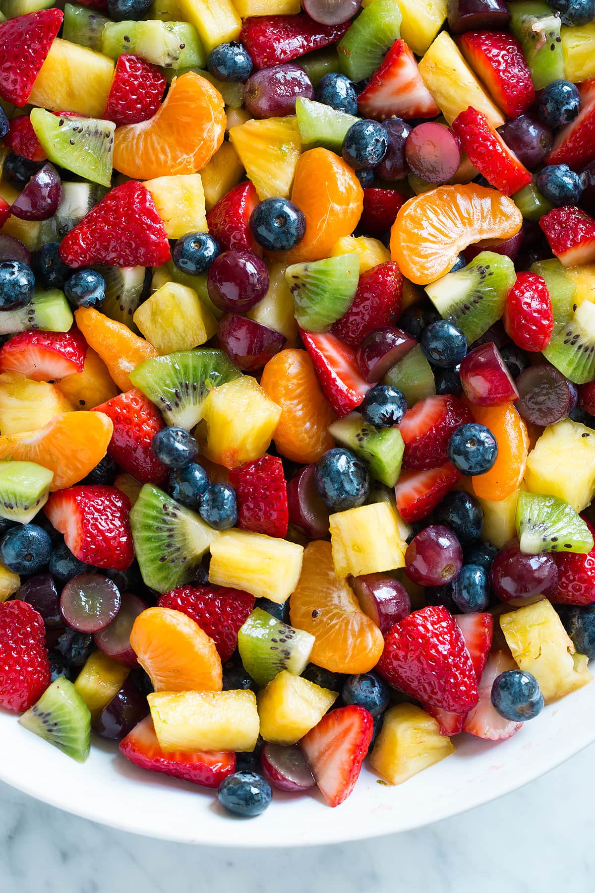 Honey Lime Rainbow Fruit Salad Close up image of fruit salad.