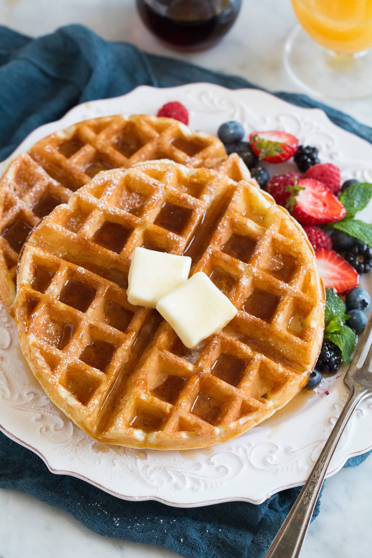 Belgian Waffles - these turn out perfect every time! Light, fluffy and tender on the inside and crisp and golden on the outside. A family favorite recipe! #belgian #waffles #breakfast Belgian Waffles