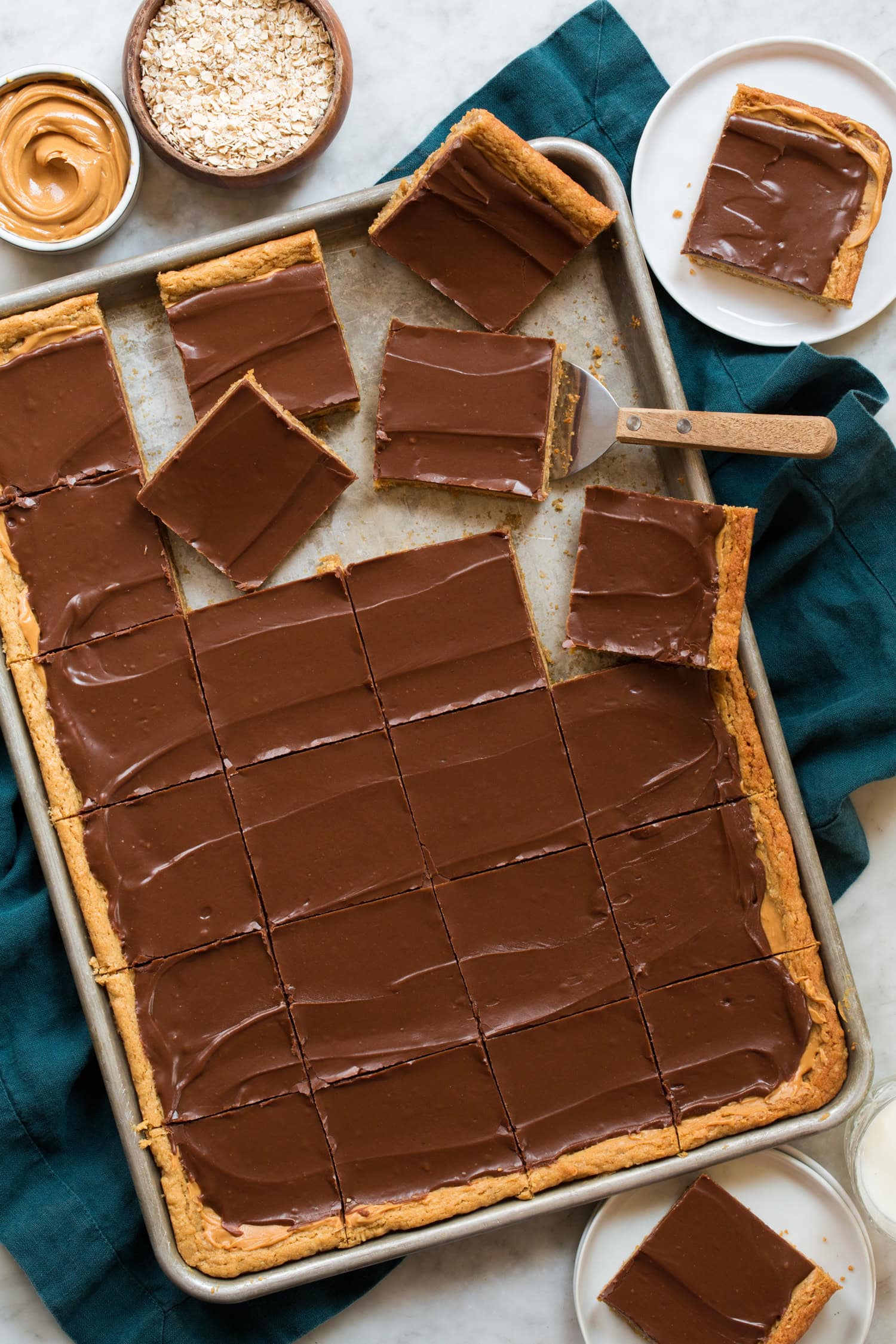 Sheet pan of peanut butter cookie bars sliced. Sheet pan of peanut butter cookie bars sliced.