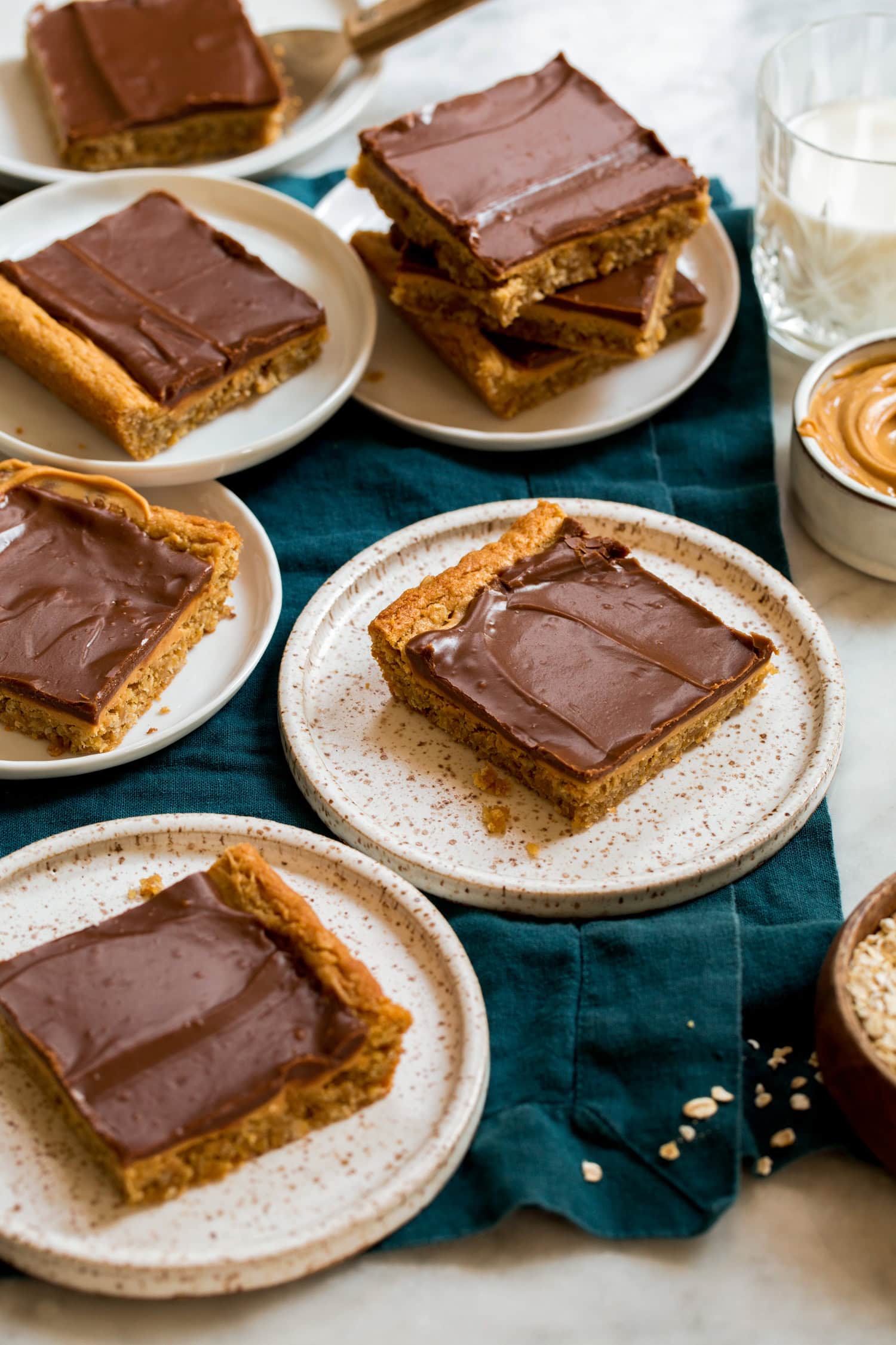 Peanut Butter Bars Single servings of peanut butter bar cookie squares on small dessert plates.