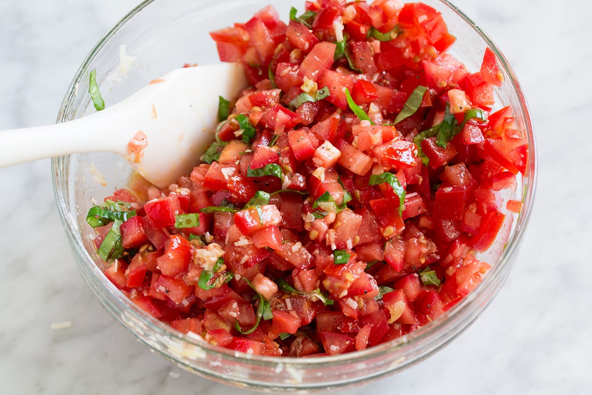 Fresh Bruschetta Tomato bruschetta mixture in a glass mixing bowl
