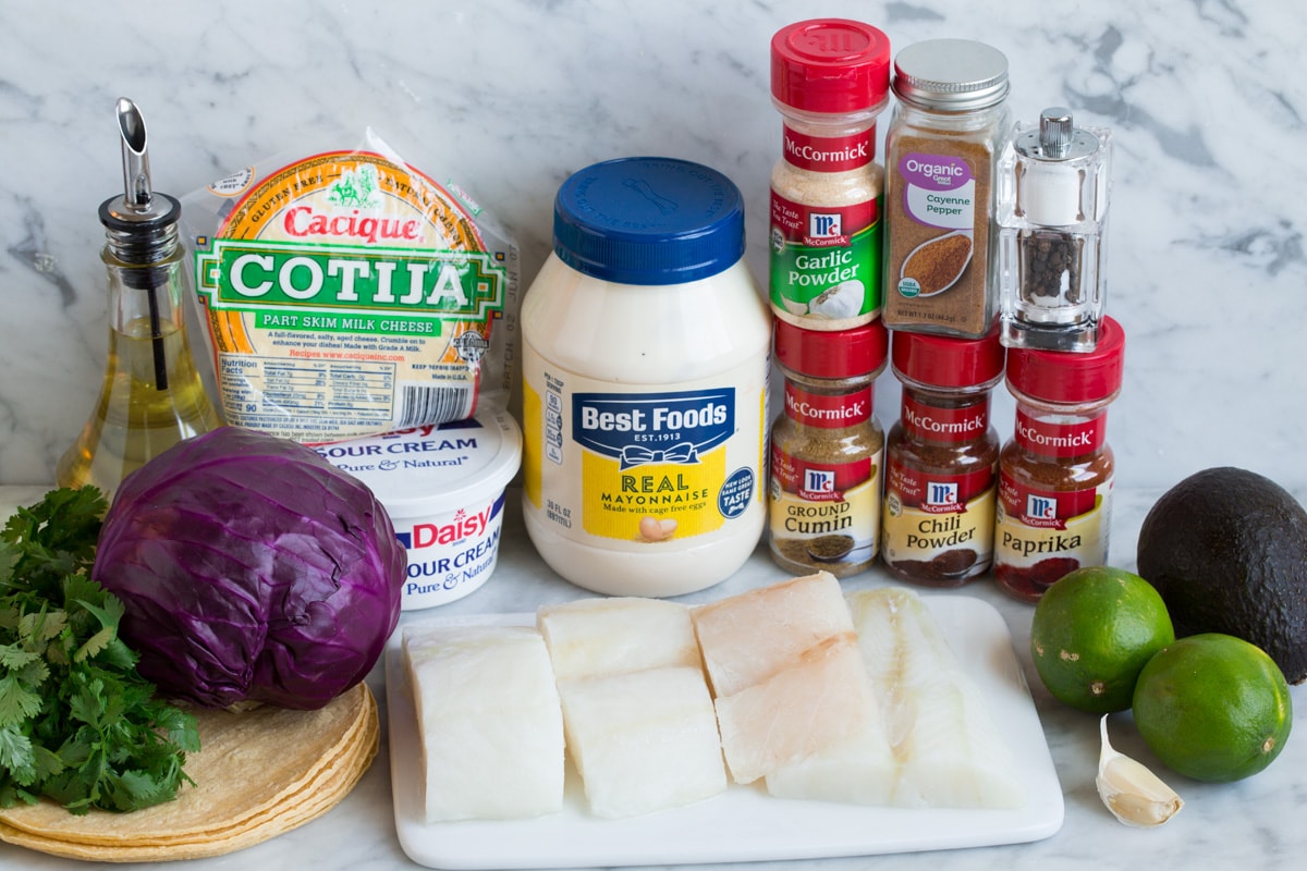 Fish Tacos - these are unbelievably delicious! Easy to make too! Includes directions for oven or grill - you'll love both, just don't omit the sauce! #fishtacos #tacos #fish #recipe Ingredients in fish tacos.