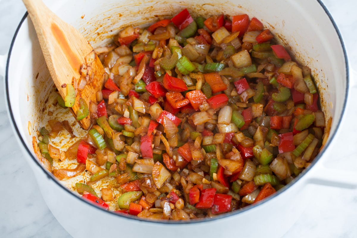 Perfect Red Beans and Rice - delicious Louisiana style comfort food at it's best! #redbeans #rice #southern #recipe #dinner Adding spices to bell pepper mixture.