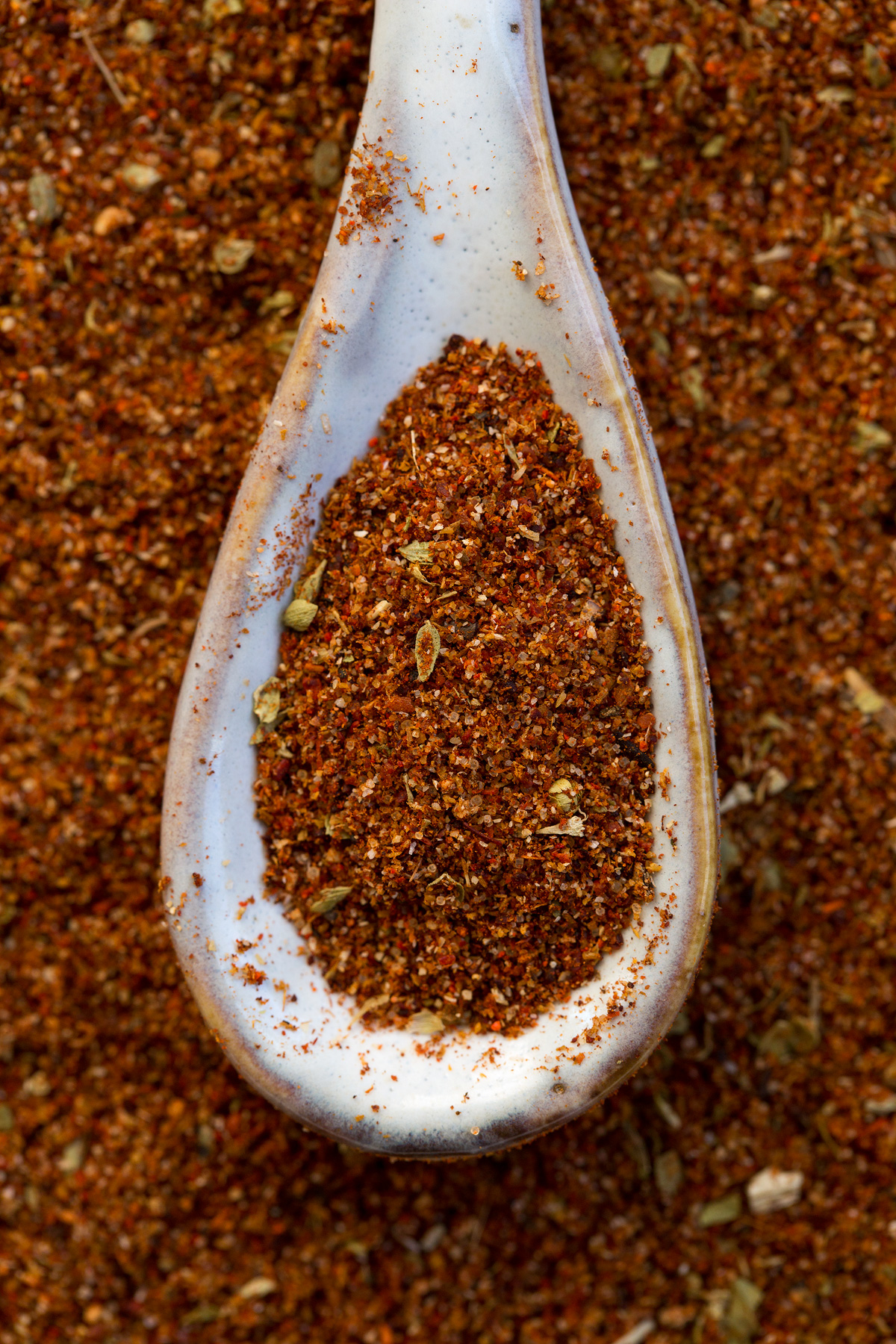 Homemade Taco Seasoning Close up image of taco seasoning in a teaspoon.