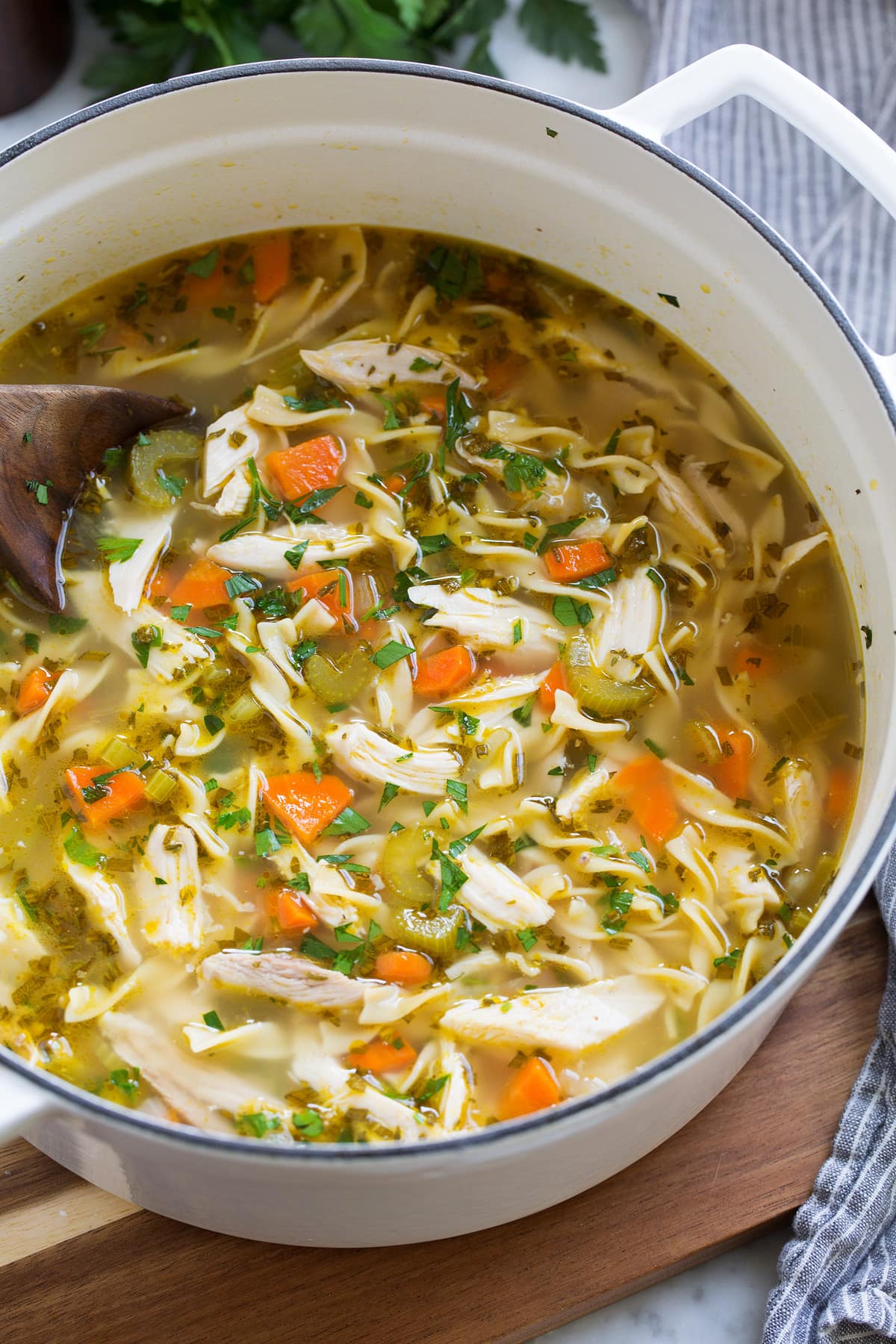 The BEST Quick and Easy Chicken Noodle Soup! This has been my go-to recipe for years. So easy and everyone always loves it! #chickennoodle #soup #dinner #chicken Pot full of quick and easy chicken noodle soup