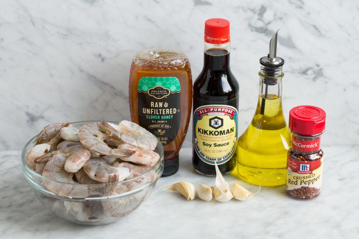 Grilled Shrimp with Honey Garlic Marinade - only 4 ingredients in this fast, easy and flavorful marinade! Perfect for a quick dinner! #shrimp #marinade #grilledshrimp #dinner #recipe Grilled shrimp and marinade ingredients.