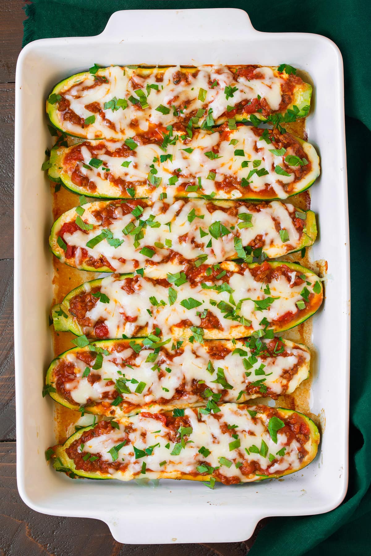 Lasagna Stuffed Zucchini Boats lasagana stuffed zucchini boats in baking dish after baking
