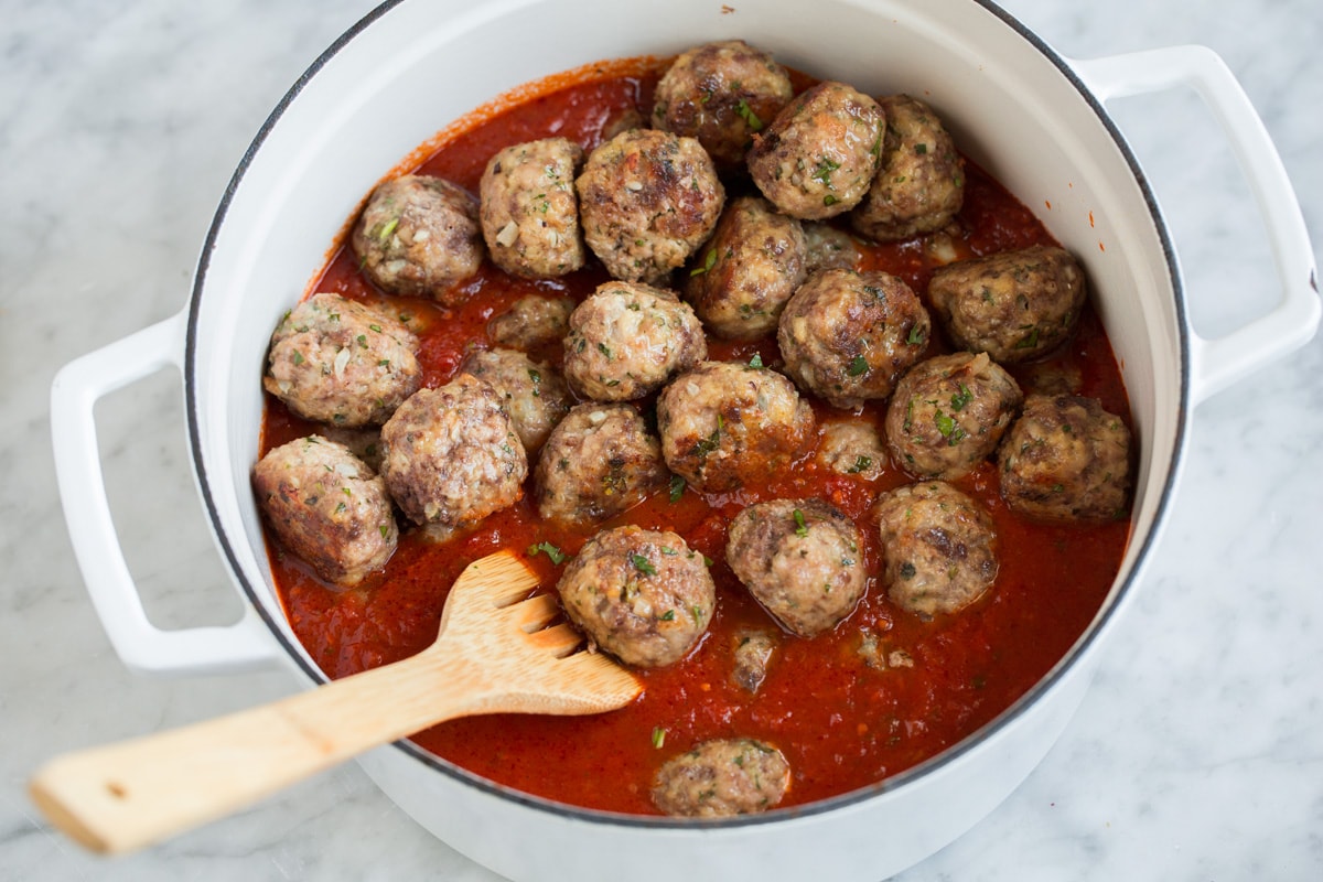 BEST MEATBALLS - these are so flavorful, so tender and packed with fresh ingredients! Makes the best spaghetti and meatballs ever! #meatballs #spaghetti #italian #dinner #groundbeef #pork #recipe Meatball recipe with marinara