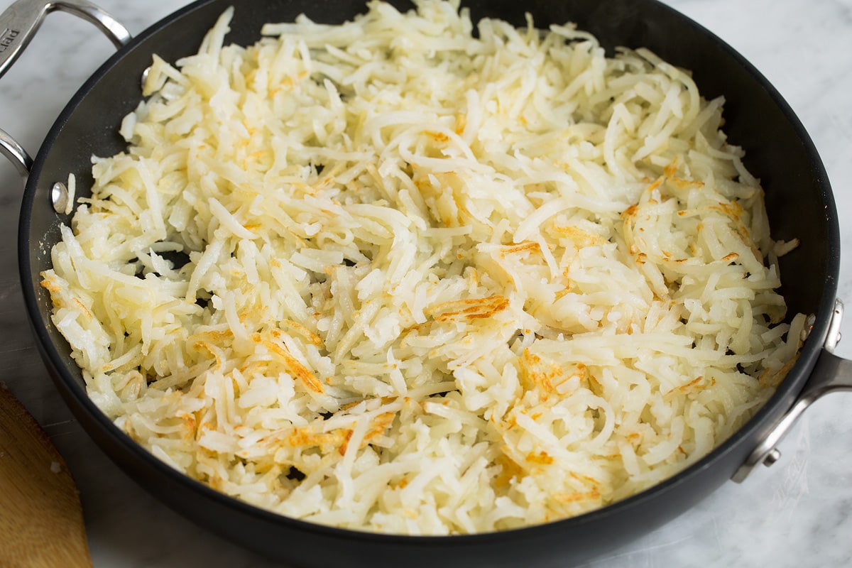 Breakfast Casserole Sautéed hash browns in a large skillet.