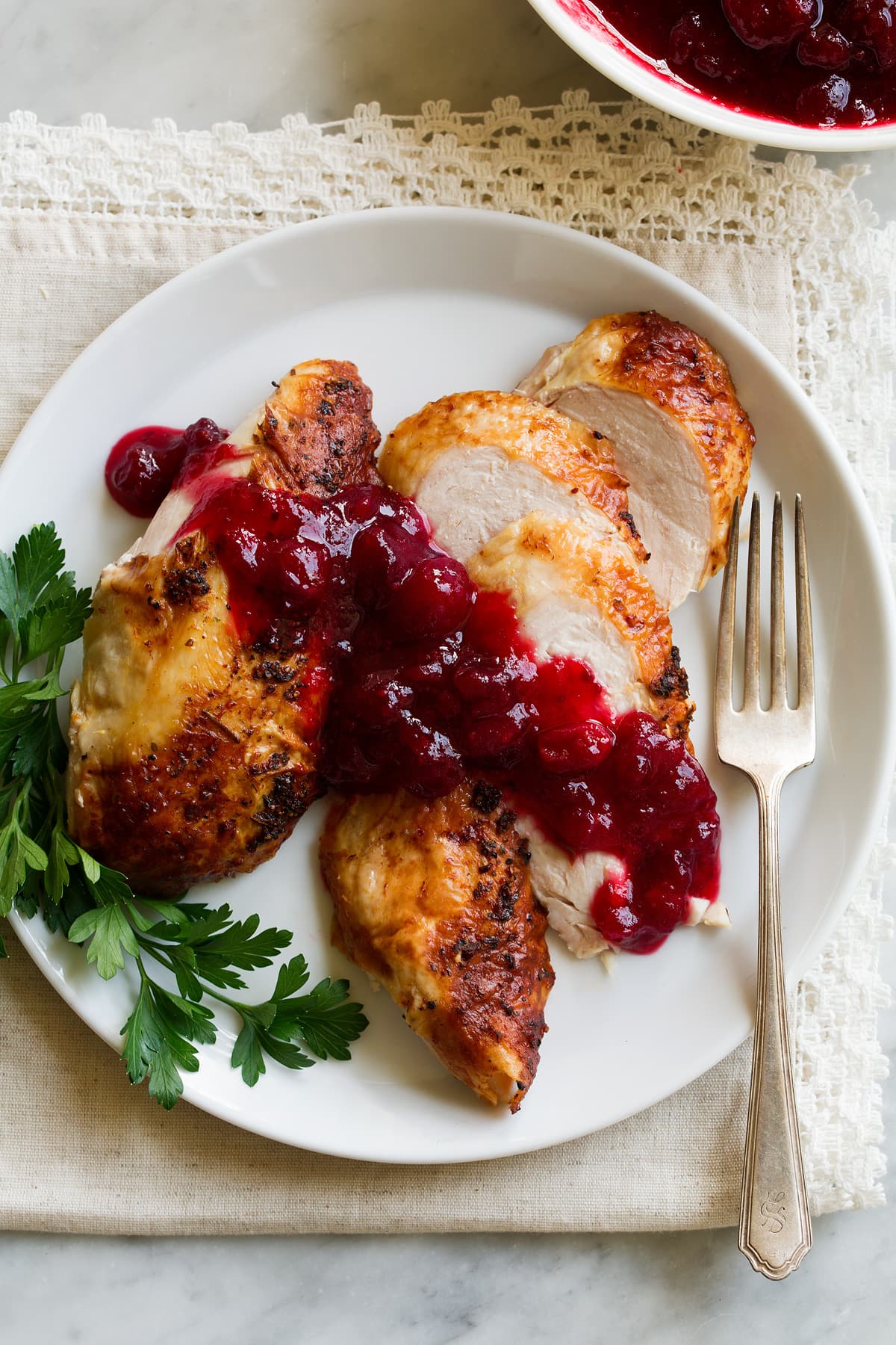 Fresh Cranberry Sauce Recipe Cranberry sauce spread over chicken.