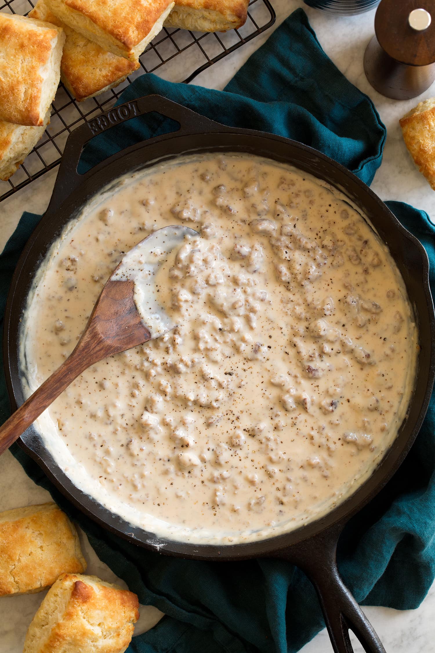 Biscuits and Sausage Gravy Sausage gravy in a cast iron skillet shown from above.