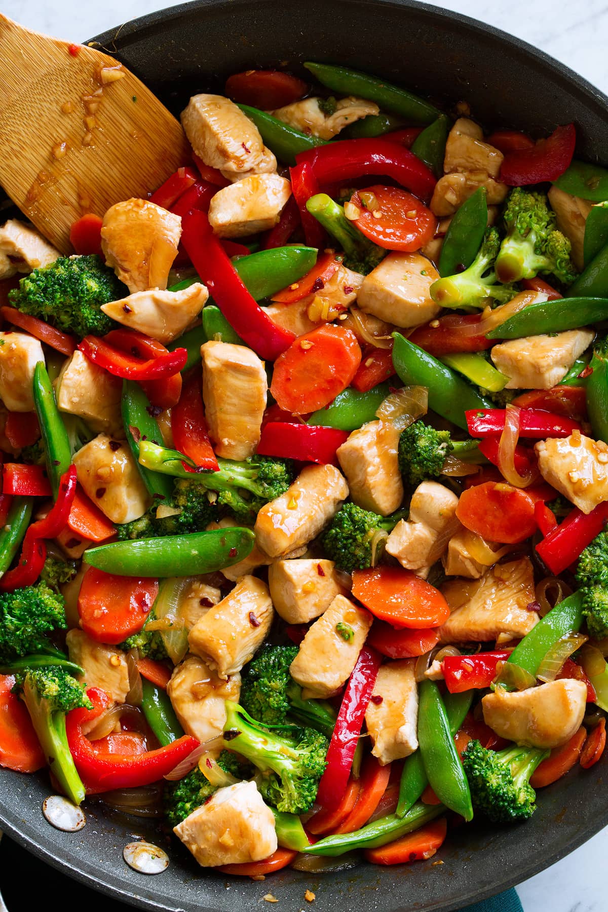 Chicken Stir Fry Healthy chicken stir fry in a pan.