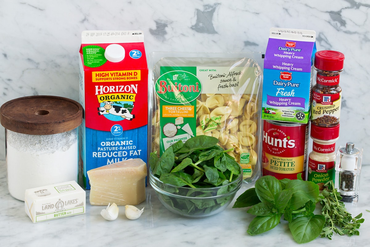 Creamy Spinach Tomato Tortellini Image of ingredients that go into spinach and tomato tortellini.
