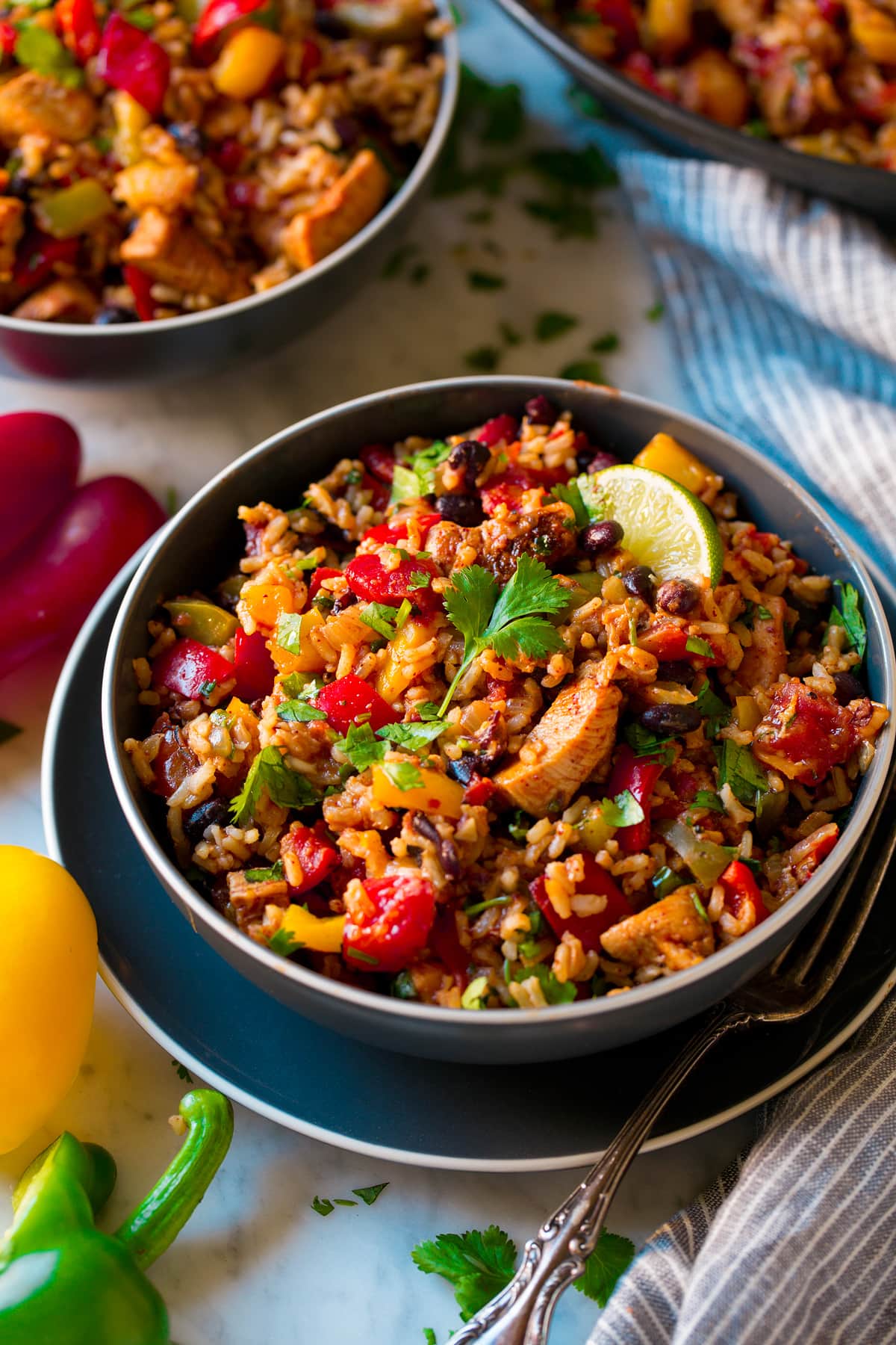 Chicken Fajita Rice Bowls Chicken Fajita Rice Bowl shown as two servings in dark blue bowls.