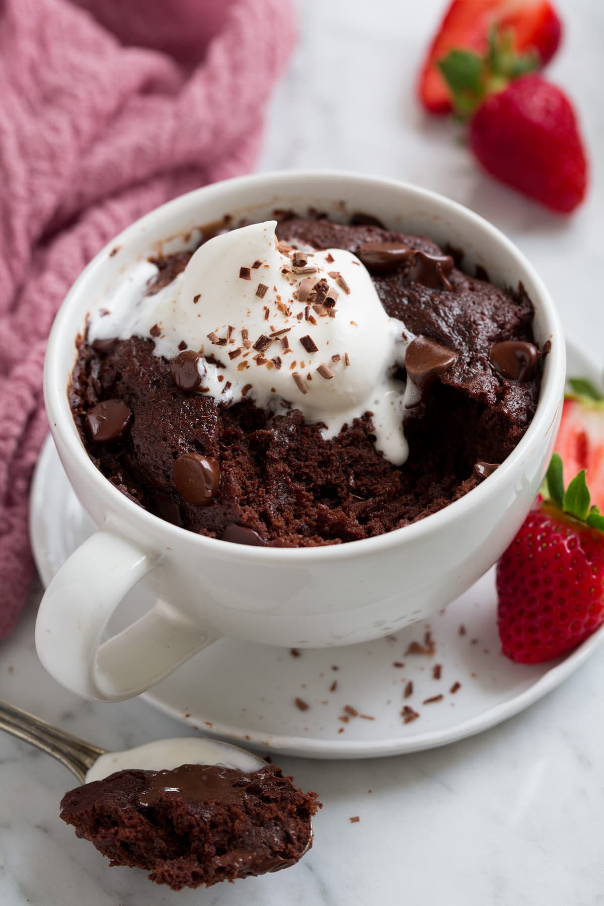 Chocolate Mug Cake Chocolate Mug Cake with a scoop removed to show filling.