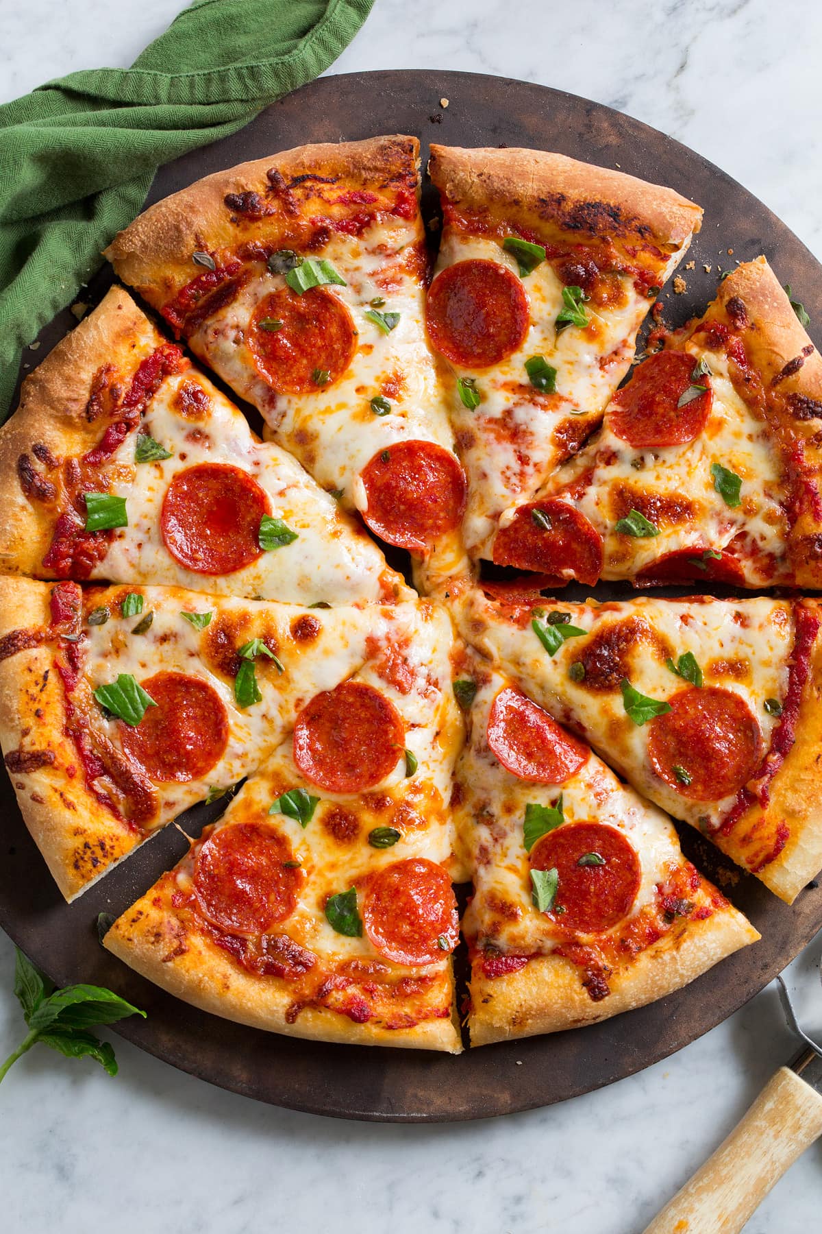 Homemade Pizza Dough Overhead image of pepperoni pizza with homemade crust. Pizza is cut into 8 slices.