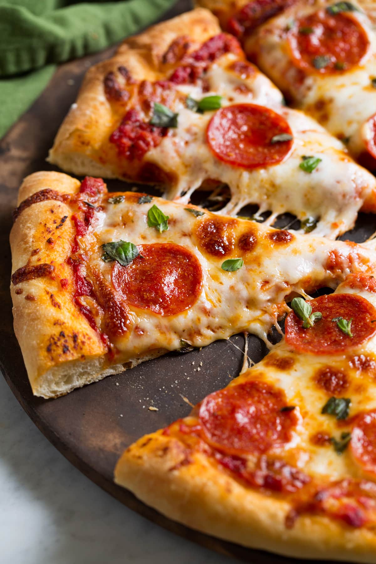Homemade Pizza Dough Recipe Slices of pepperoni pizza made with a homemade pizza dough recipe.