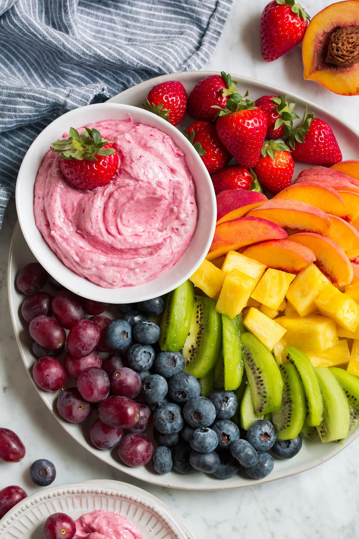 Easy Cream Cheese Fruit Dip Overhead image of easy cream cheese fruit dip on a platter with fresh fruit on the side.