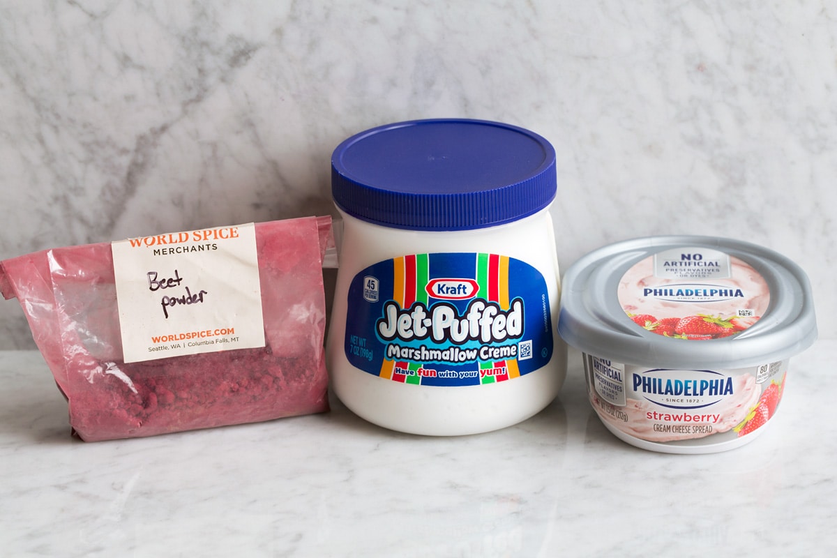 Easy Cream Cheese Fruit Dip Image of 2 ingredients used to make fruit dip, marshmallow fluff plus cream cheese. Plus also shows optional beet powder to tint fruit dip.