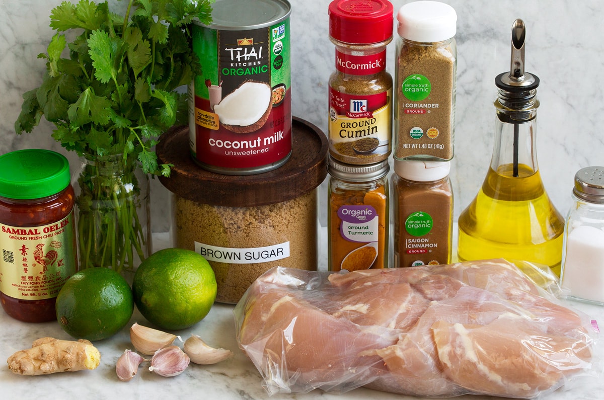 Thai Coconut Grilled Chicken Thighs Image of marinade ingredients and chicken for Thai coconut grilled chicken thighs.