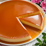 Image of flan with a slice cut.