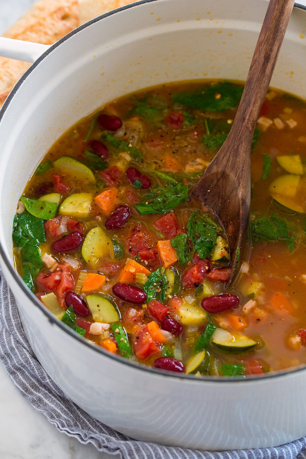 Minestrone Soup Pot full of minestrone soup shown from the side.
