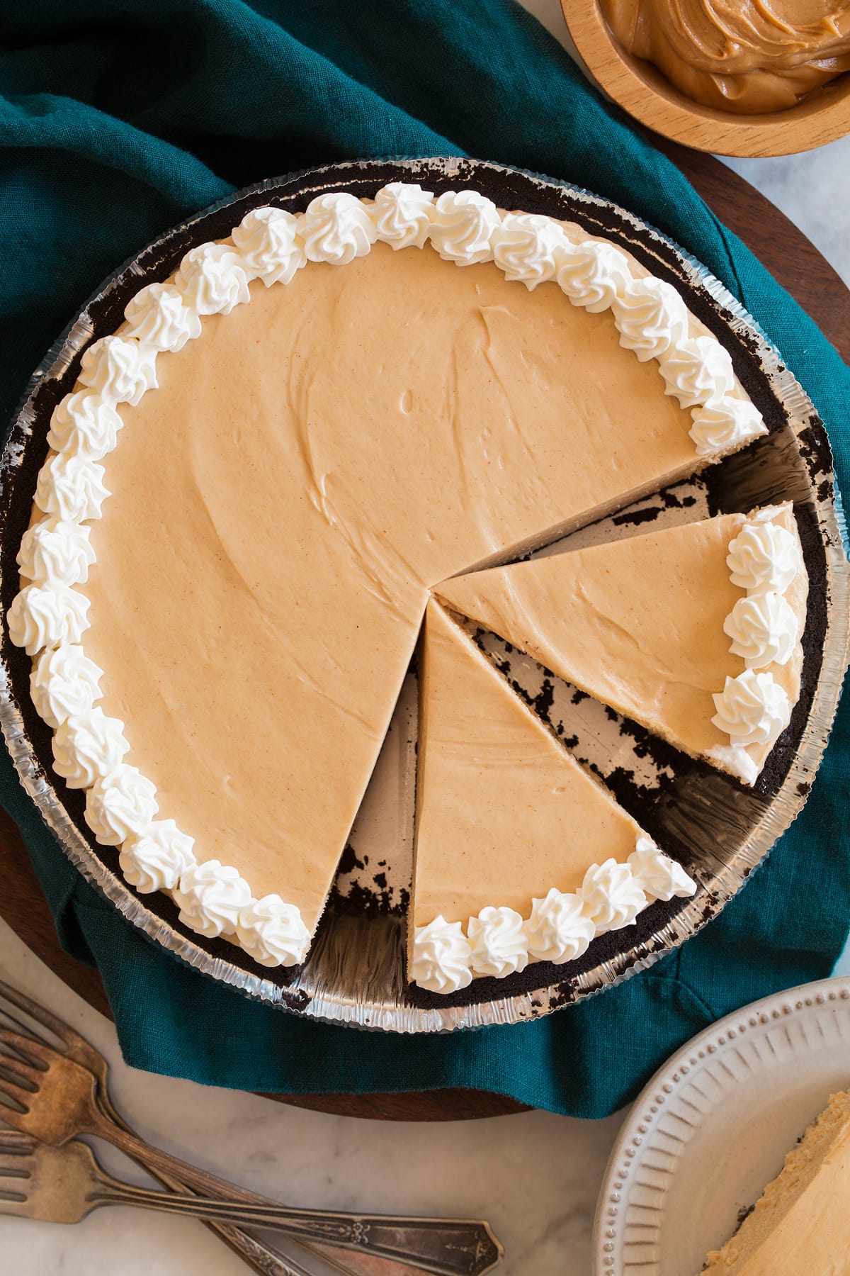 Peanut Butter Pie Overhead image of peanut butter pie with a few slices cut.